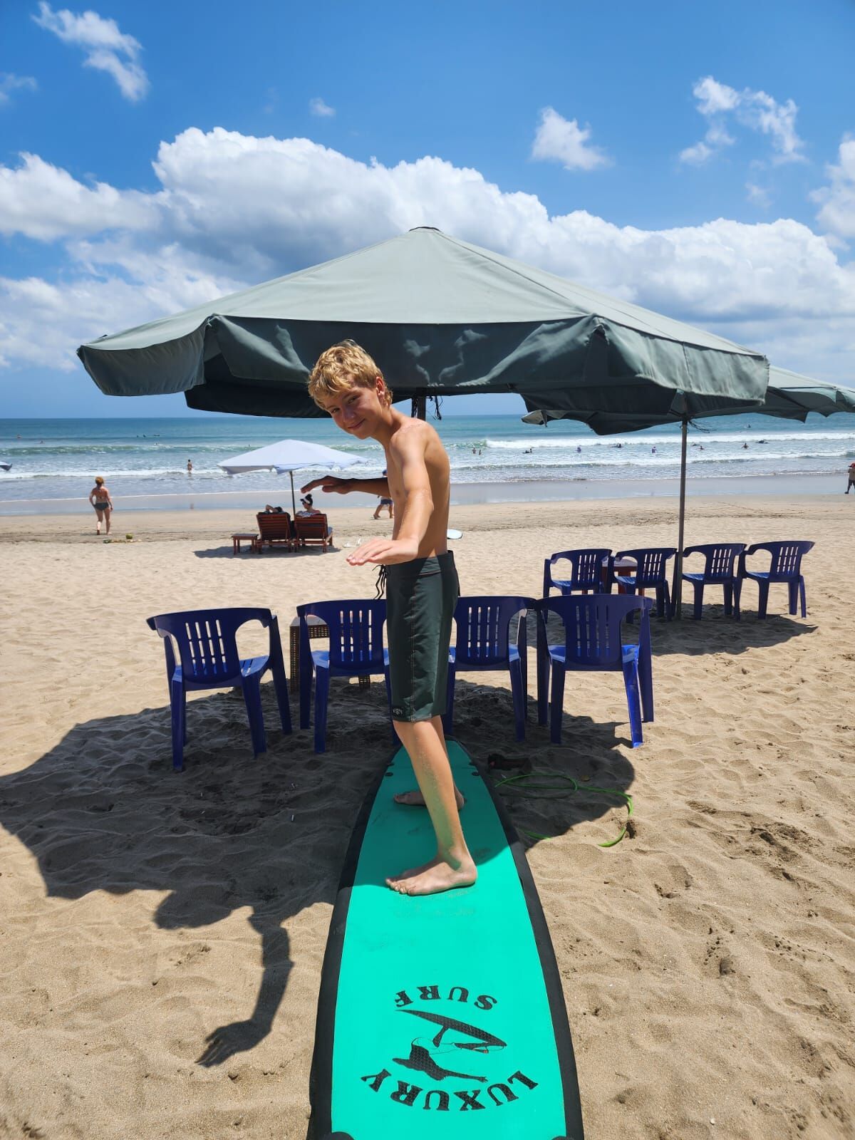 Surf equipment lineup including boards and safety gear