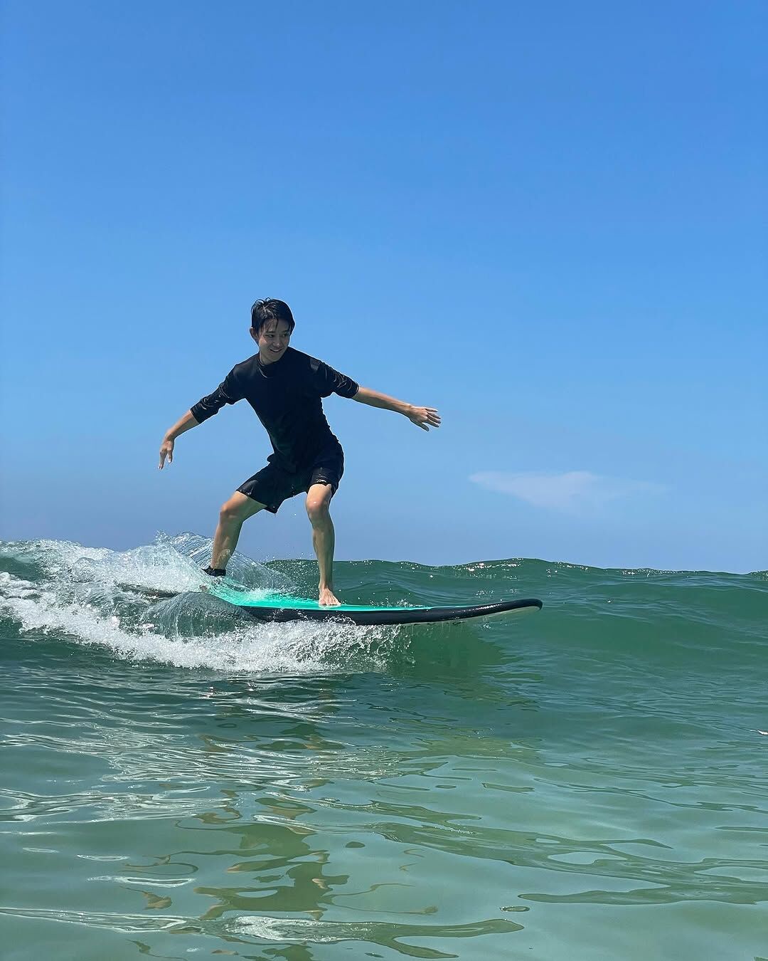 Kids learning to surf with professional instructor