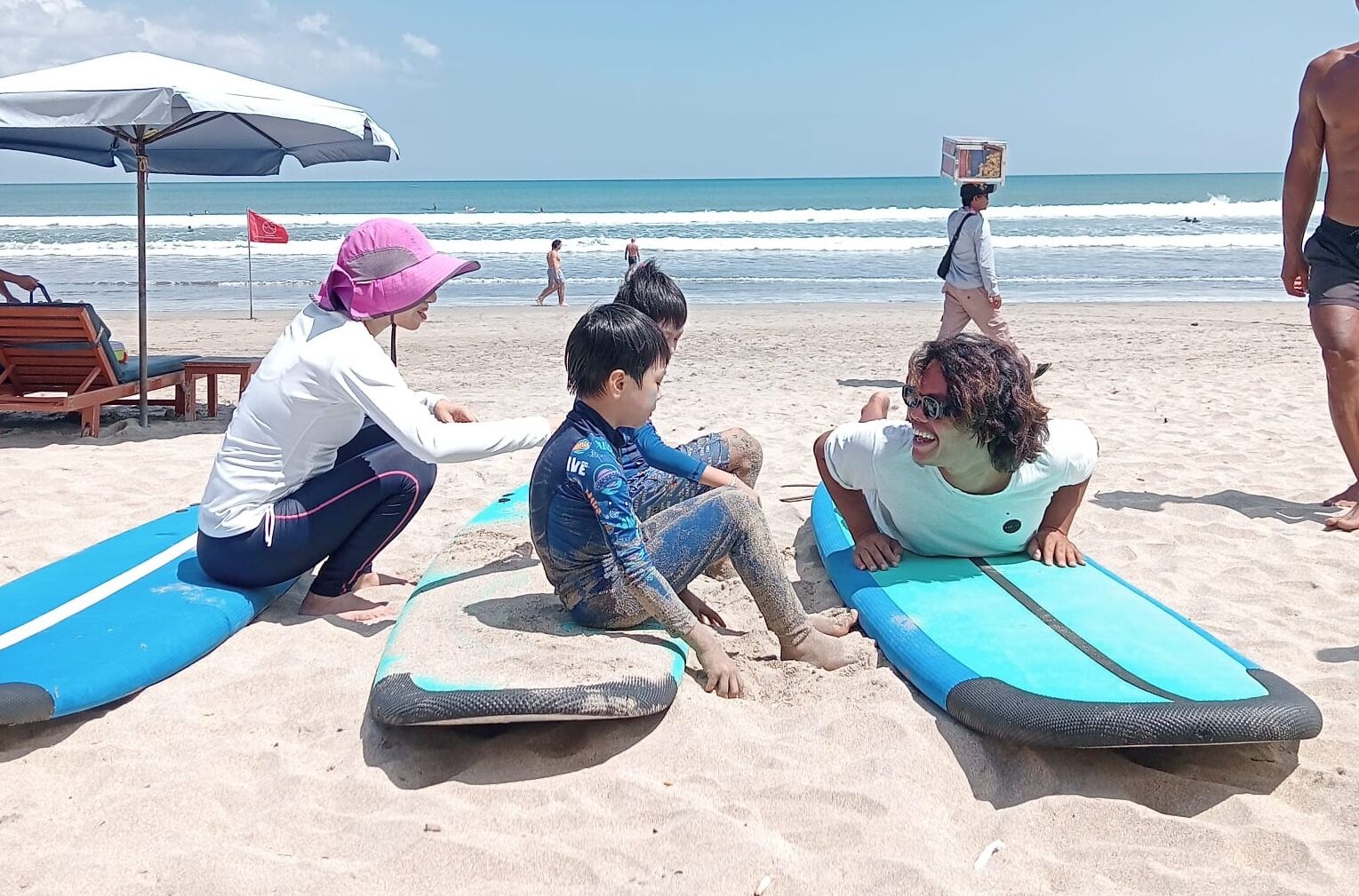 Instructor demonstrating proper pop-up technique on the beach